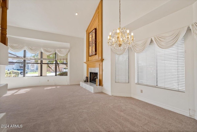 unfurnished living room with carpet, a chandelier, and a premium fireplace