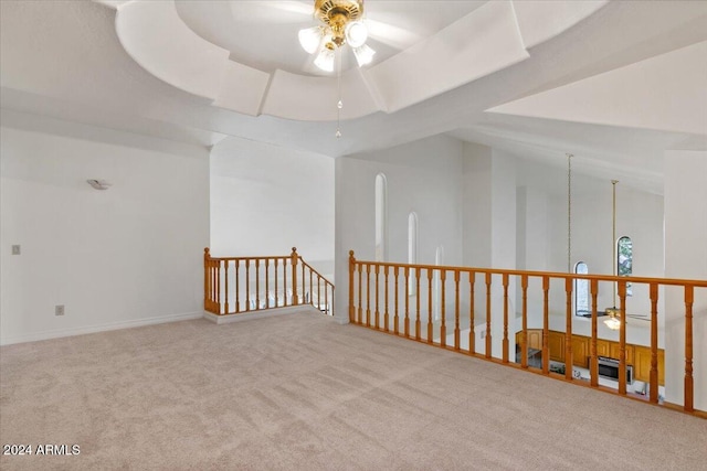 additional living space featuring light colored carpet, ceiling fan, and lofted ceiling