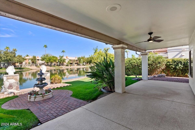 view of patio / terrace with a water view and ceiling fan