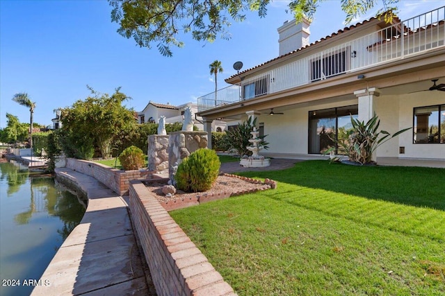 view of yard with a balcony