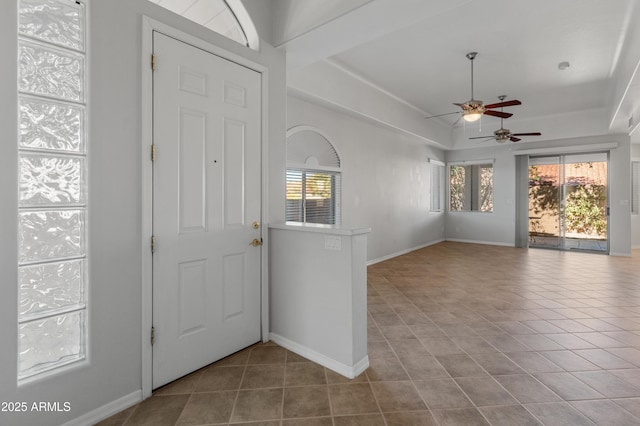 tiled foyer entrance featuring ceiling fan