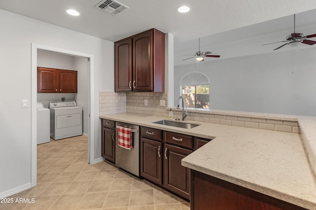 kitchen with washing machine and clothes dryer, sink, stainless steel dishwasher, ceiling fan, and backsplash