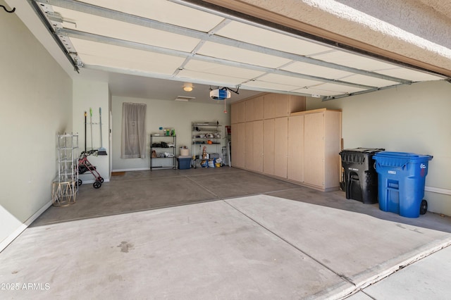 garage featuring a garage door opener