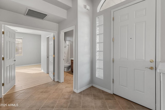 entrance foyer featuring light tile patterned floors