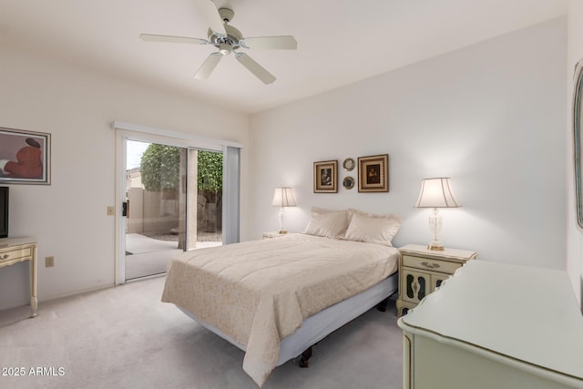 bedroom featuring access to exterior, a ceiling fan, and light colored carpet