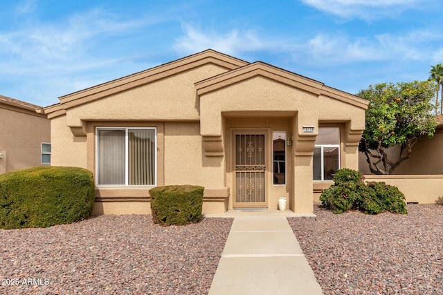 view of front of house featuring stucco siding