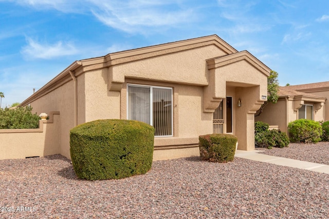 rear view of property with stucco siding