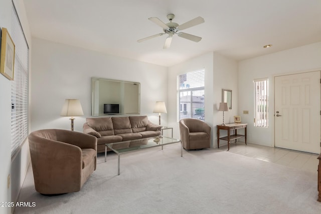 living room with tile patterned flooring, ceiling fan, and carpet flooring