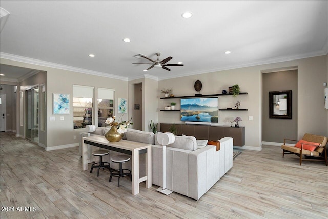 living room featuring ceiling fan, crown molding, and light hardwood / wood-style floors