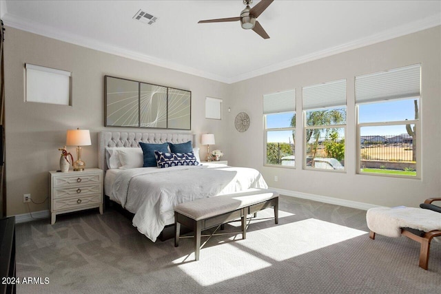 bedroom featuring dark carpet, ceiling fan, and crown molding