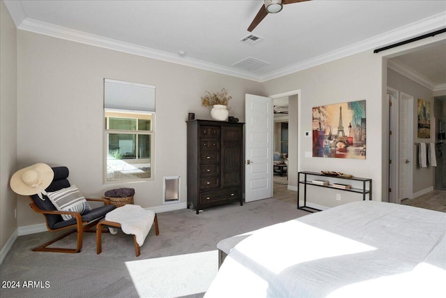 carpeted bedroom featuring crown molding and ceiling fan