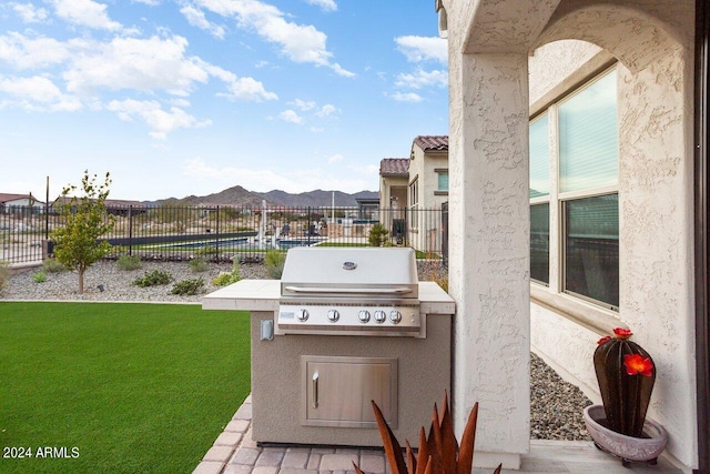 view of patio featuring grilling area and an outdoor kitchen