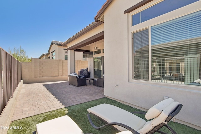 view of patio / terrace with ceiling fan and a fenced backyard