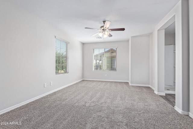 unfurnished room with carpet floors and ceiling fan