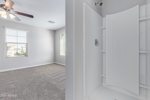 bathroom with a shower and ceiling fan