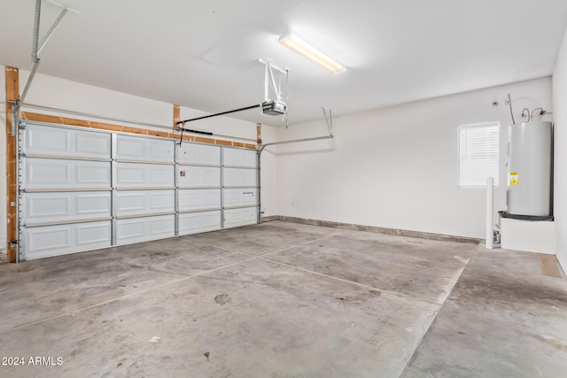 garage featuring a garage door opener and electric water heater