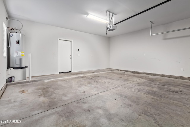 garage featuring a garage door opener and water heater