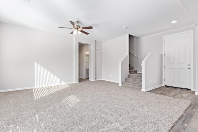 unfurnished living room with ceiling fan and light wood-type flooring