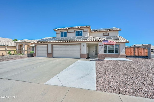 10806 W Adam Ave, Peoria, AZ 85373 - mediterranean / spanish-style home with stucco siding, solar panels, concrete driveway, a gate, and a garage
