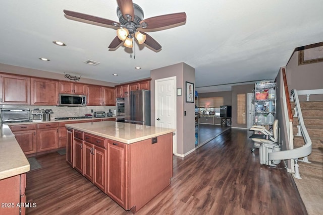 10806 W Adam Ave, Peoria, AZ 85373 - kitchen with appliances with stainless steel finishes, light countertops, dark wood-style floors, a ceiling fan, and recessed lighting