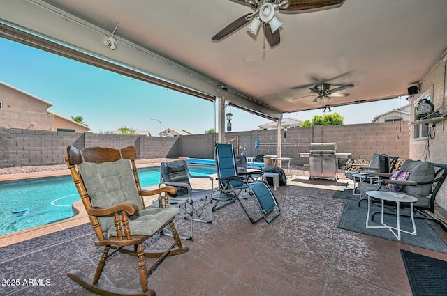 10806 W Adam Ave, Peoria, AZ 85373 - fenced backyard featuring a ceiling fan, a grill, and a patio