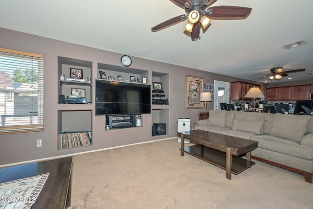 10806 W Adam Ave, Peoria, AZ 85373 - living area with a ceiling fan and light colored carpet