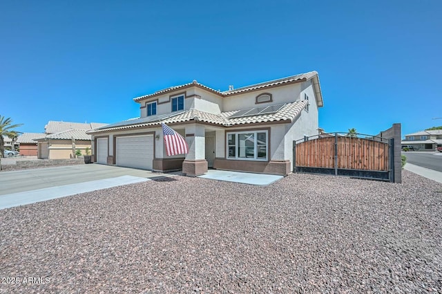 10806 W Adam Ave, Peoria, AZ 85373 - mediterranean / spanish home with a gate, stucco siding, solar panels, concrete driveway, and a garage