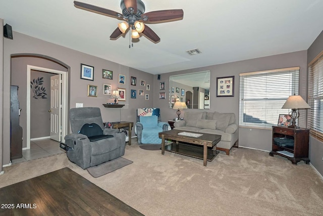 10806 W Adam Ave, Peoria, AZ 85373 - carpeted living area with ceiling fan and arched walkways