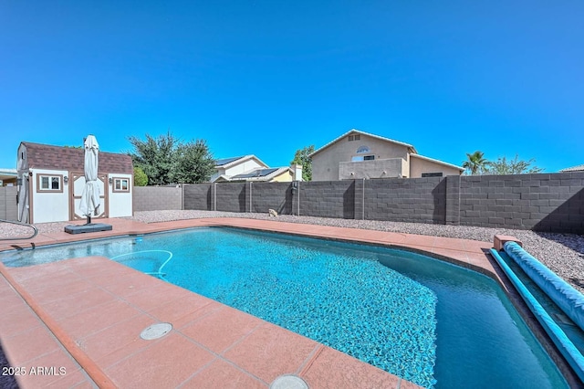 10806 W Adam Ave, Peoria, AZ 85373 - view of pool featuring a fenced backyard and a storage shed