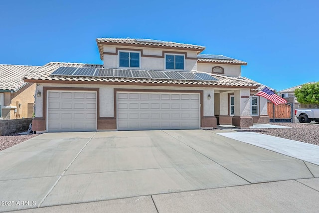 10806 W Adam Ave, Peoria, AZ 85373 - mediterranean / spanish-style house featuring roof mounted solar panels, concrete driveway, stucco siding, and a tile roof