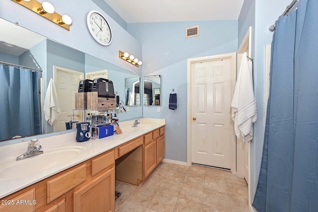 10806 W Adam Ave, Peoria, AZ 85373 - full bathroom featuring double vanity, a shower with curtain, and tile patterned flooring