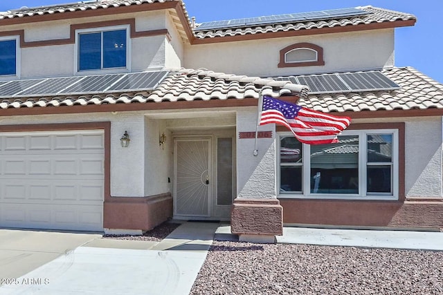 10806 W Adam Ave, Peoria, AZ 85373 - view of front facade with roof mounted solar panels, a tile roof, and stucco siding