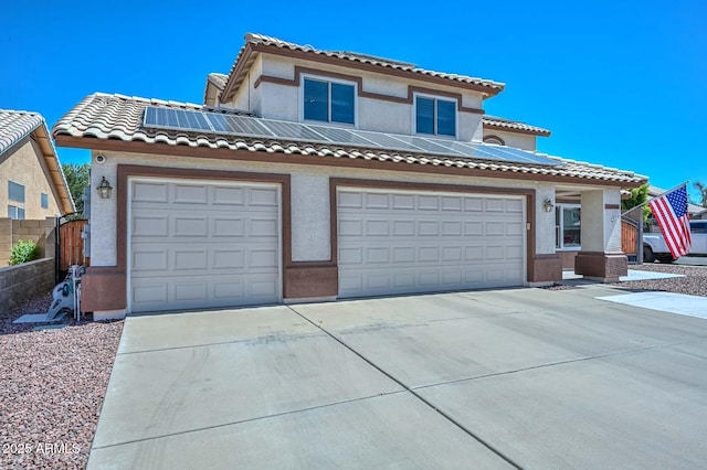 10806 W Adam Ave, Peoria, AZ 85373 - view of front of property with solar panels, driveway, a tiled roof, and stucco siding