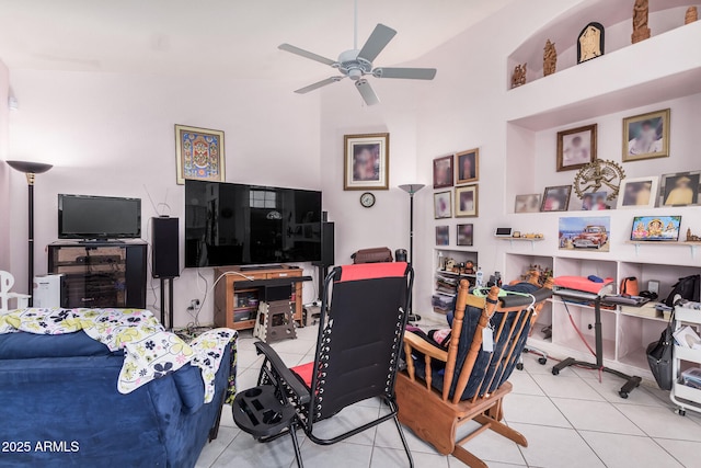 tiled living room featuring ceiling fan and high vaulted ceiling