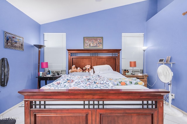 tiled bedroom with lofted ceiling