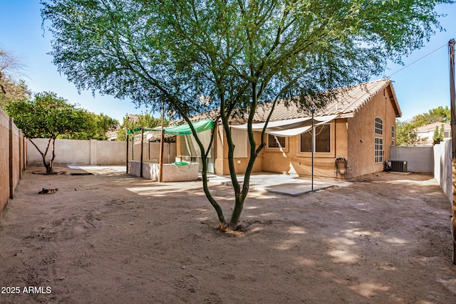 back of property with a patio and central air condition unit