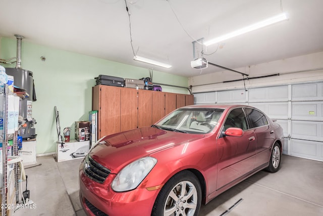 garage with water heater and a garage door opener