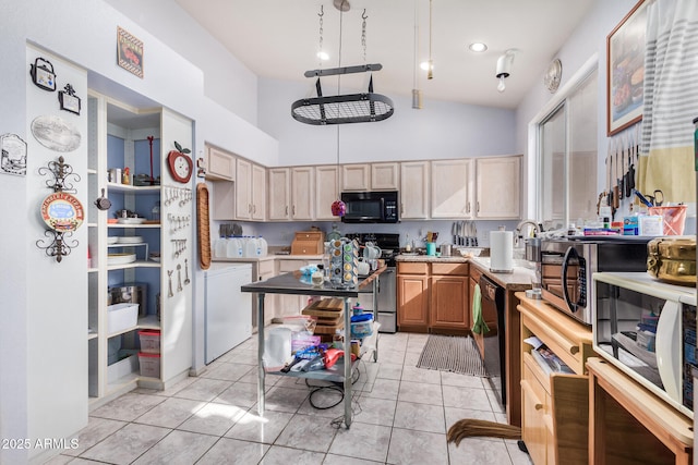 kitchen featuring black appliances, light tile patterned floors, and light brown cabinets