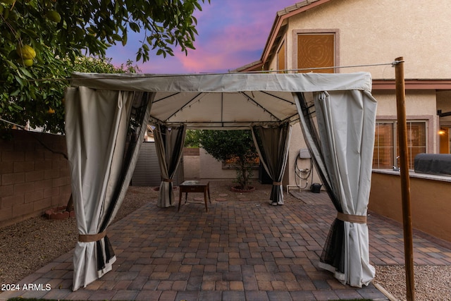 patio terrace at dusk with a gazebo