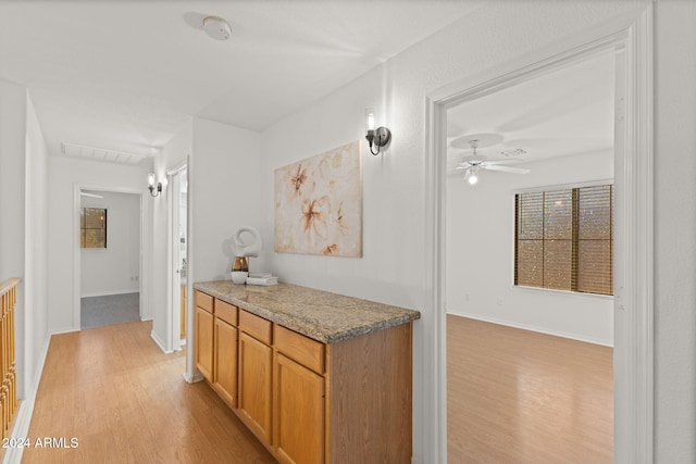 interior space featuring hardwood / wood-style flooring and ceiling fan