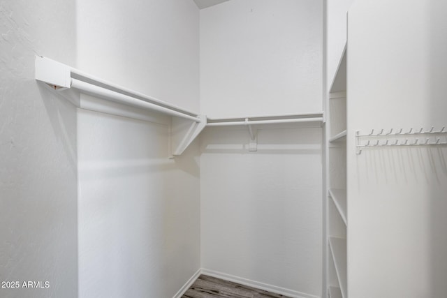 spacious closet with wood finished floors