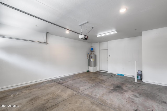 garage with baseboards, a garage door opener, and water heater