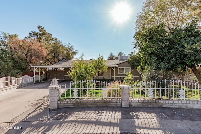 view of property hidden behind natural elements with a carport