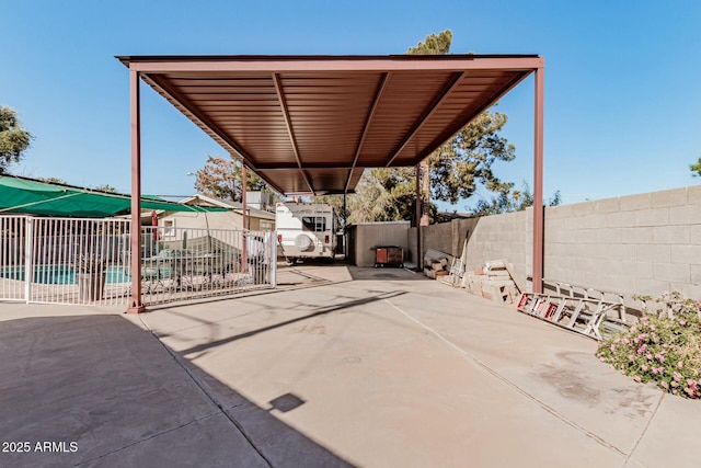 3601 W Solano Dr, Phoenix, AZ 85019 - view of patio / terrace featuring a carport and a fenced in pool