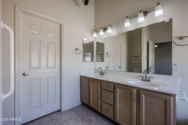 bathroom with tile patterned floors, toilet, and vanity