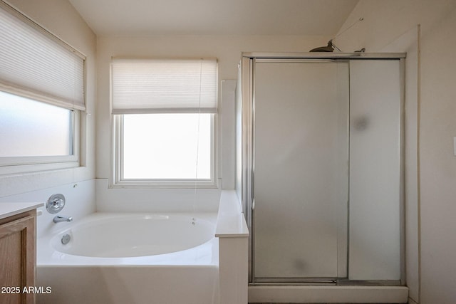 bathroom with vanity and plus walk in shower