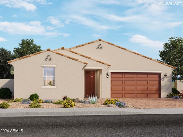 mediterranean / spanish-style house featuring a garage