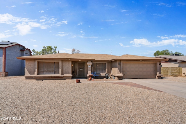 single story home with a garage