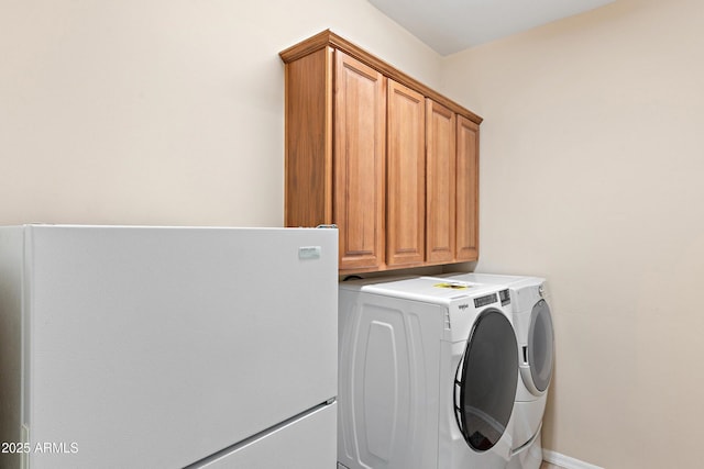 laundry area featuring cabinet space and washer and dryer