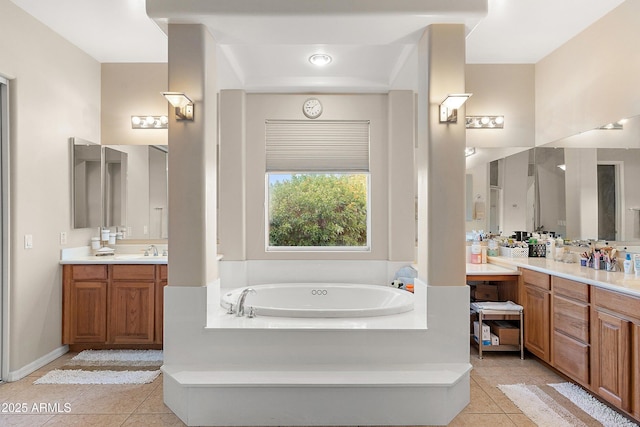 full bath with a garden tub, tile patterned flooring, vanity, and baseboards